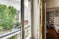 a lovely view of the courtyard garden in a 1-bedroom Paris luxury apartment