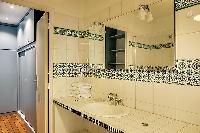 bathroom sink  in a 1-bedroom Paris luxury apartment