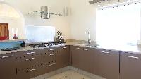 cool kitchen of Saint Barth Villa Au Coeur Du Rocher luxury holiday home, vacation rental