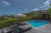 cool poolside deck of Saint Barth Villa Lagon Jaune Estate luxury holiday home, vacation rental