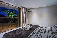 cool bedroom with terrace at Saint Barth Villa Apache luxury holiday home, vacation rental