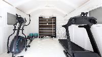 cool gym equipment in fitness room of Saint Barth Villa Ixfalia luxury holiday home, vacation rental