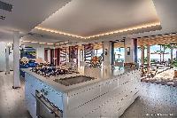 swanky kitchen island of Saint Barth Luxury Villa Blanc Bleu holiday home, vacation rental