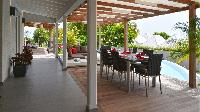 cool poolside patio of Saint Barth Luxury Villa Evan holiday home, vacation rental