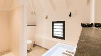 spic-and-span toilet and bath in Saint Barth Luxury Villa Fourchue holiday home, vacation rental