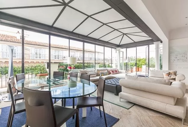 awesome living room in the solarium of Rome Via Del Corso luxury apartment