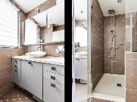 lovely bathroom with a sink and walk-in shower  in a 1-bedroom Paris luxury apartment