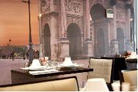 classy restaurant with Arc de Triomphe artwork in Hotel Waldorf Madeleine in Paris