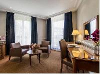 huge floor to ceiling French windows and beautiful cornices in Hotel Waldorf Madeleine in Paris