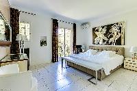 spacious master bedroom of Cannes - Palm Spring Villa luxury apartment