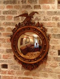 vintage mirror on brick wall in Paris luxury apartment