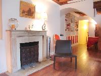 a decorative stone fireplace in a 2-bedroom Triplex Paris apartment