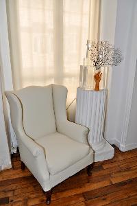 white armchair in Paris luxury apartment