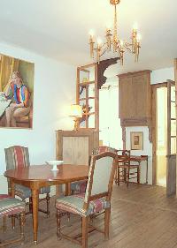 classy dining area seats four people in Paris luxury apartment