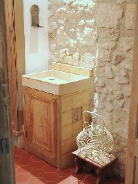 stone-walled sink in Paris luxury apartment