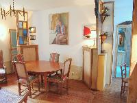 classy dining area seats four people in Paris luxury apartment