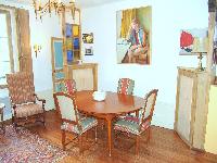 classy dining area seats four people in Paris luxury apartment