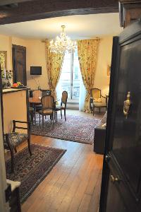 distinctively warm, authentic, and gorgeous 1-bedroom Paris luxury apartment with exposed beams and 