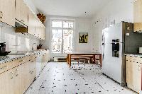 well-equipped kitchen in a 4-bedroom Paris luxury apartment
