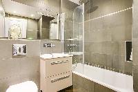 fresh and clean bathroom with tub in République - Voltaire luxury apartment