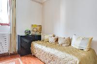 second bedroom with a single bed in a Paris luxury apartment