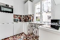 modern and fully functional kitchen in a 3-bedroom Paris luxury apartment