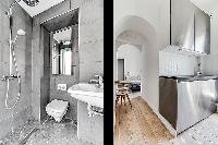 modern contemporary designed bathroom and kitchen in a charming studio Paris apartment