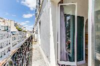 balcony with street view in a charming studio Paris apartment