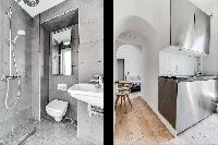 modern contemporary designed bathroom and kitchen in a charming studio Paris apartment