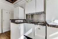 functional kitchenette in a studio Paris luxury apartment