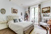 bedroom fitted with queen size bed and huge glass windows with access to the lovely terrace in 3-bed