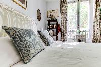 beautiful and well-appointed bedroom in 3-bedroom Paris luxury apartment