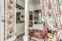 elegant and well-decorated en suite bathroom with tub, and a boudoir in 3-bedroom Paris luxury apart