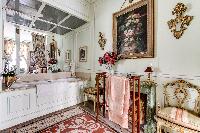 elegant and well-decorated en suite bathroom with tub, and a boudoir in 3-bedroom Paris luxury apart
