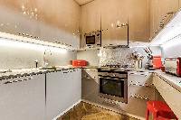 modern fully equipped kitchen in 3-bedroom Paris luxury apartment