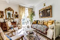 massively decorated living room in 3-bedroom Paris luxury apartment