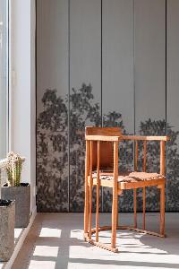 geometric stylish wooden chair in Paris luxury apartment