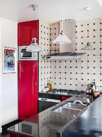 scarlet and gray kitchen in Paris luxury apartment