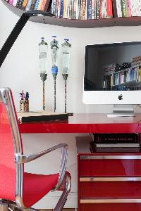 vibrant red computer table and chair in Paris luxury apartment