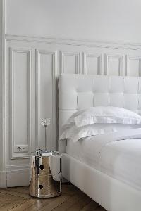 white-walled comfy bed in Paris luxury apartment