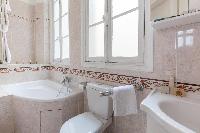 sparkling shower room and tiled en suite in Paris luxury apartment