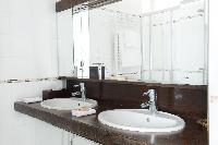 sleek bath with double sink in Paris luxury apartment