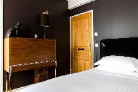 master bedroom tiled in sleek black in Paris luxury apartment