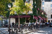 Le Marais neighborhood surrounded by restaurants, bars, and cafés close to Paris luxury apartment