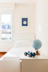 kids room with 2 single beds in Paris luxury apartment