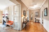 hallway with antique toy rocking horse and parquet floor in Paris luxury apartment