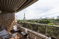 spectacular views along the Seine to the iron silhouette of the Eiffel Tower from the balcony of a P