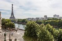 spectacular views along the Seine to the iron silhouette of the Eiffel Tower from the balcony of a P