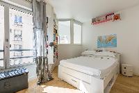 kids’ quarter with pastel-painted bedroom in Paris luxury apartment