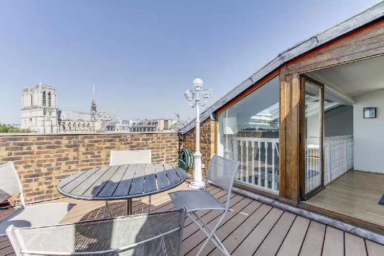 terrace with wonderful view of the Notre Dame de Paris in a Paris luxury apartment